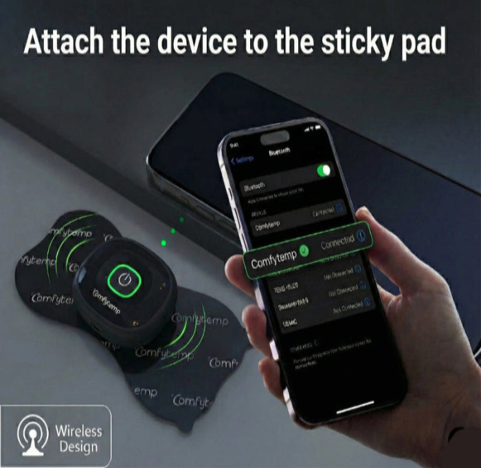 Hand holding a smartphone with app interface, attached to a wireless device on a sticky pad.